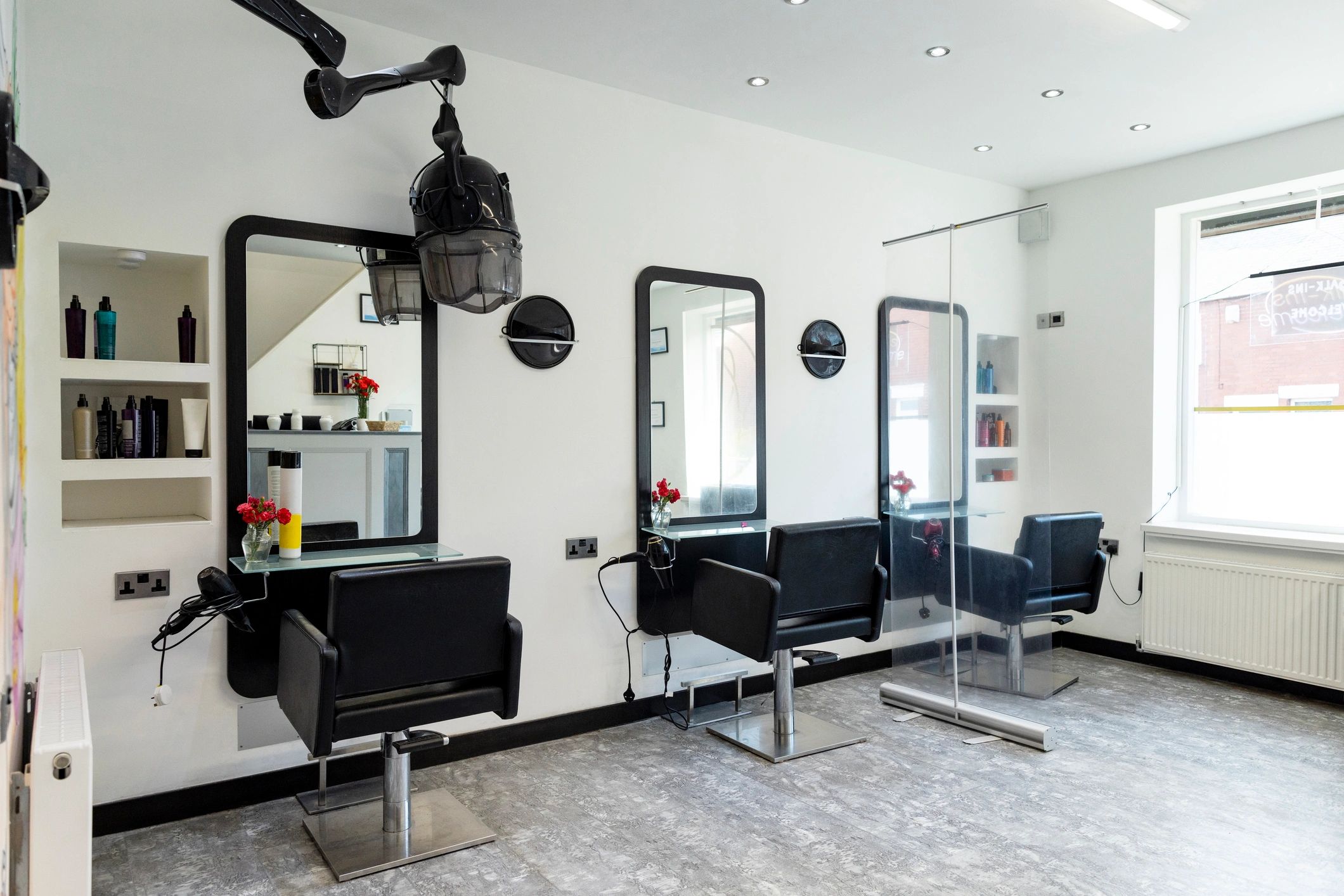 Salon interior with styling chairs and mirrors