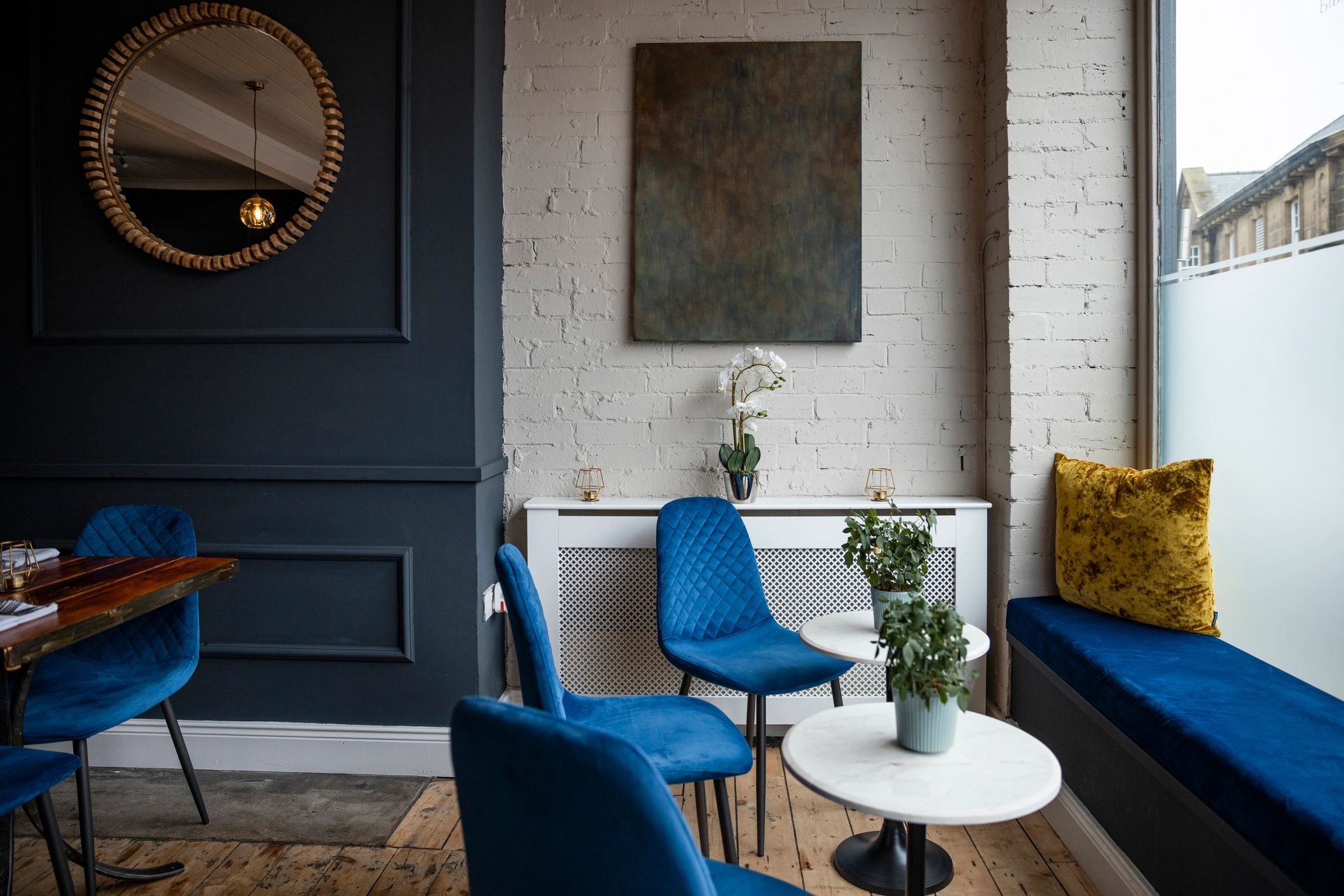 Bright, modern salon interior with styling stations