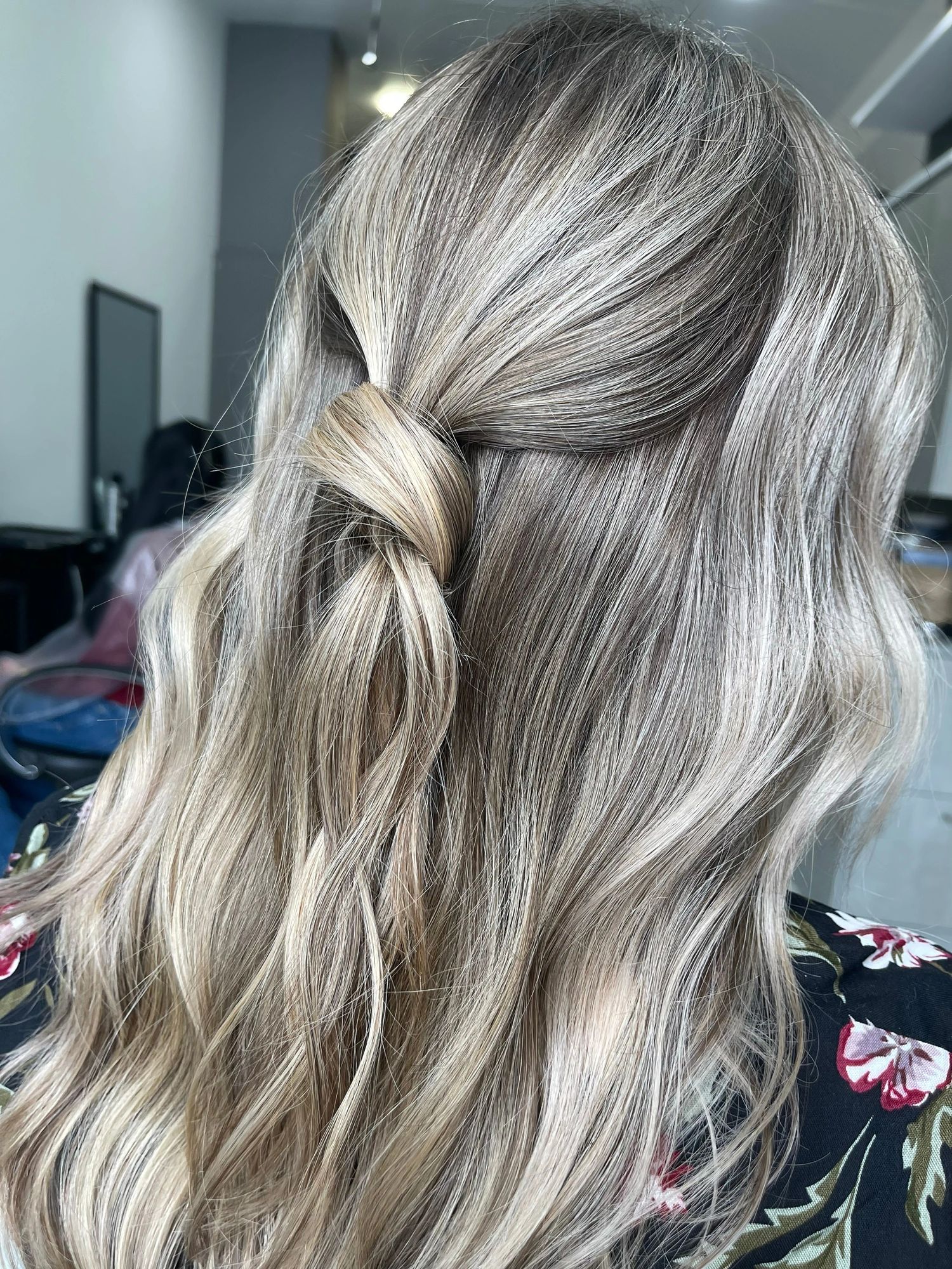 Close-up of long curly hair with dimensional balayage color